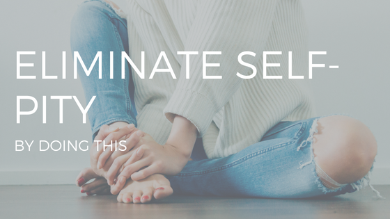 "ELIMINATE SELF PITY" IN WHITE TEXT OVER A PHOTO OF A WOMAN WEARING A SWEATER AND JEANS, LOOKING SAD