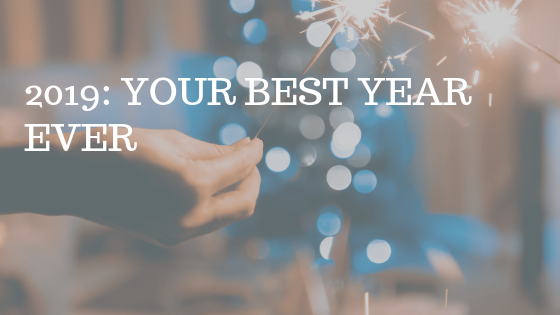 Hand holding sparkler, with white text over reading "2009: your best year ever"