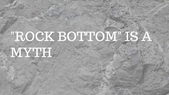 GREY ROCK SURFACE WITH TEXT "ROCK BOTTOM IS A MYTH"